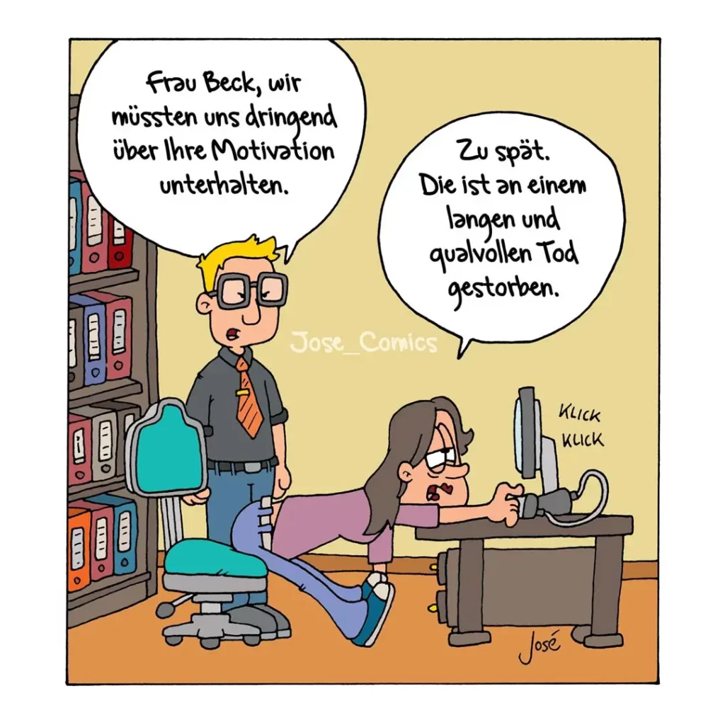 Mann mit Brille im Büro spricht zu Frau am Schreibtisch, die frustriert auf ihren Computer haut