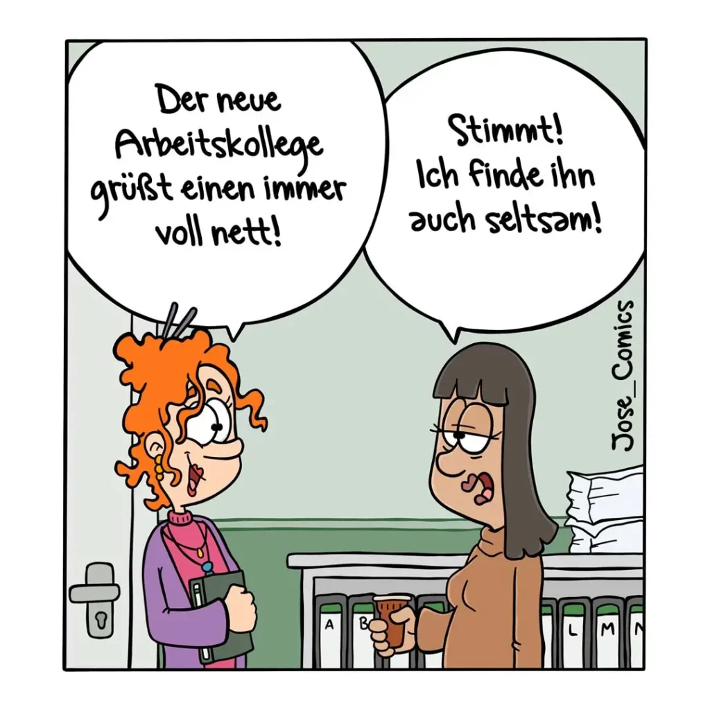 Zwei Frauen im Büro: links eine mit orangem lockigem Haar in violetter Bluse, rechts eine mit schwarzem Haar in braunem Oberteil. Sie unterhalten sich vor einem Aktenschrank.