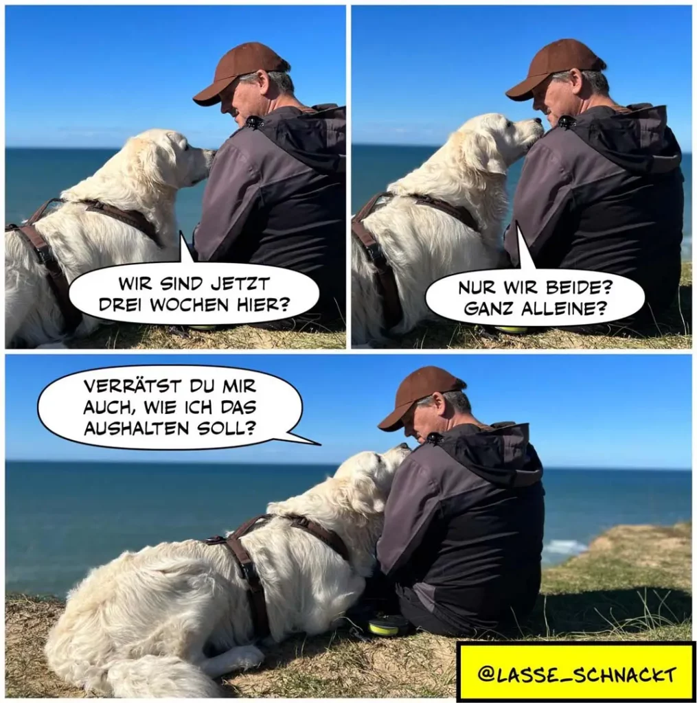 Halter und weisser Hund sitzen an Küstenkliff mit Meerblick. Halter fragt den Hund, wie lange sie noch bleiben, der Hund antwortet, dass sie jetzt zu zweit sind.